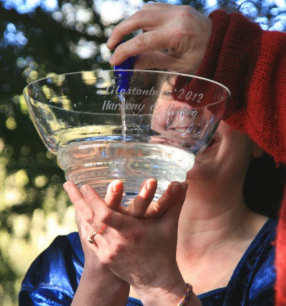 Morgana West holds up the Glastonbury 2012 bowl